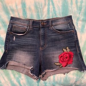 High waisted denim shorts with rose patch